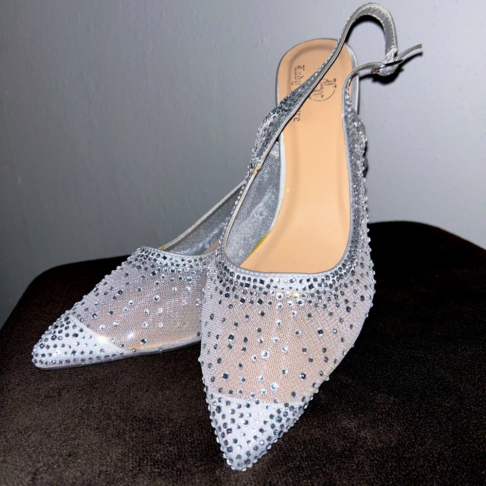 Juicy Couture size 9 1.5 inch sparkle heel. Silver sparkle slingback. Never worn